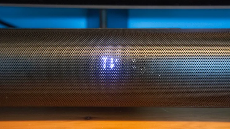 The LED display on the front of the Creative Stage Pro soundbar showing "TV" as the source