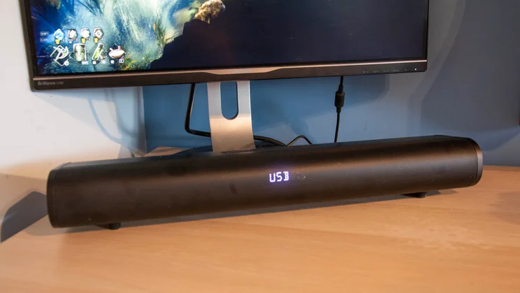 The Creative Stage Pro soundbar positioned under the Philips Brilliance 258B monitor