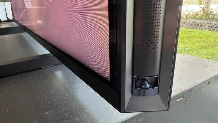 Close-up of the bottom corner of the Hisense 116UX RGB Mini LED TV
