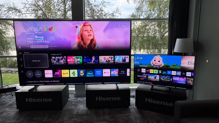 The Hisense 116UX RGB Mini LED TV alongside a 55in TV for size comparison