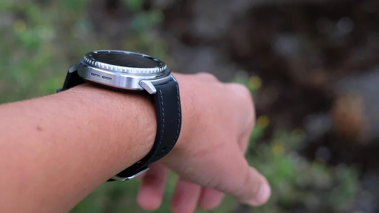 The Samsung Galaxy Watch 8 Classic being worn on a wrist held at an angle to show how well it fits
