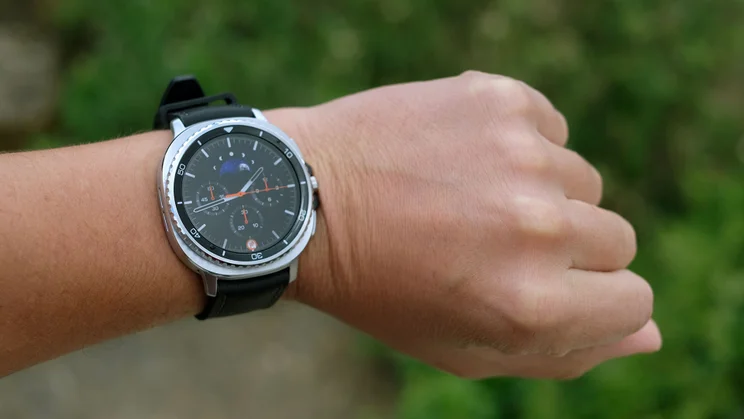 The Samsung Galaxy Watch 8 Classic being worn on a wrist while displaying a clock face