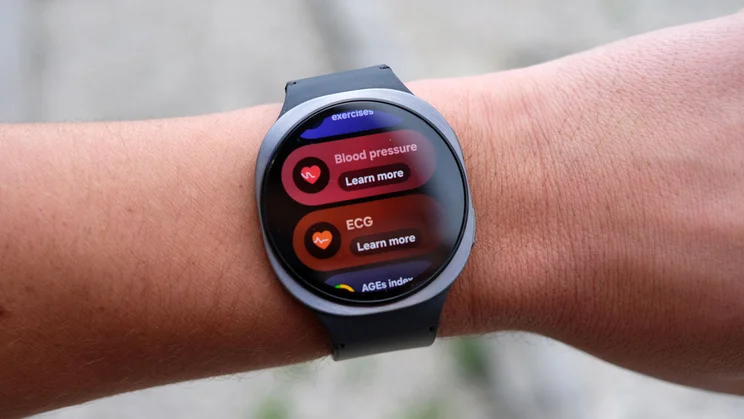 The Samsung Galaxy Watch 8 being worn on a wrist and displaying the Blood Pressure and ECG readings