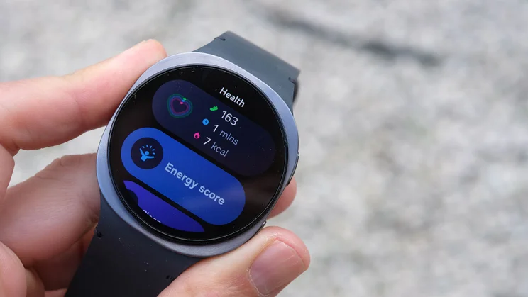 The Samsung Galaxy Watch 8 being worn on a wrist and displaying the Energy Score calculation