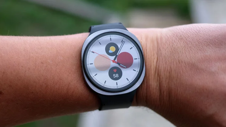 The Samsung Galaxy Watch 8 being worn on a wrist and displaying a clock face