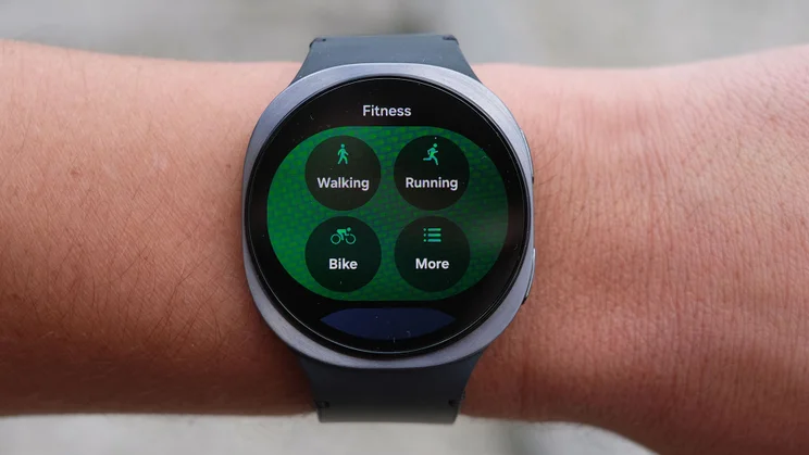 The Samsung Galaxy Watch 8 being worn on a wrist and displaying Fitness options