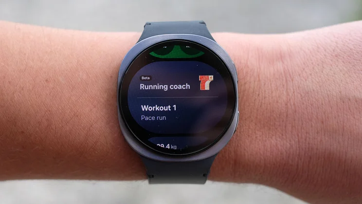 The Samsung Galaxy Watch 8 being worn on a wrist and displaying the new Running Coach functionality
