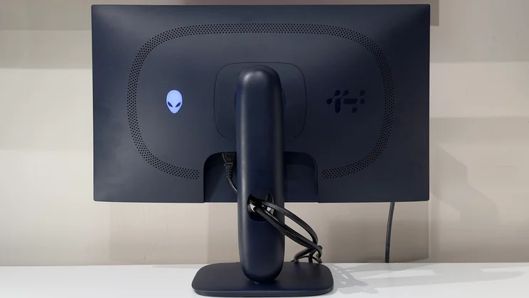 The rear of the Alienware AW2725D gaming monitor, showing the cable tidying system at work