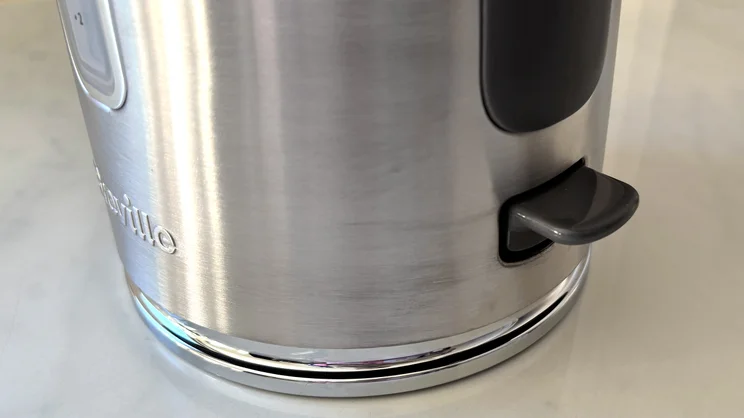 A closeup of the Breville Edge Low Steam kettle's on/off switch