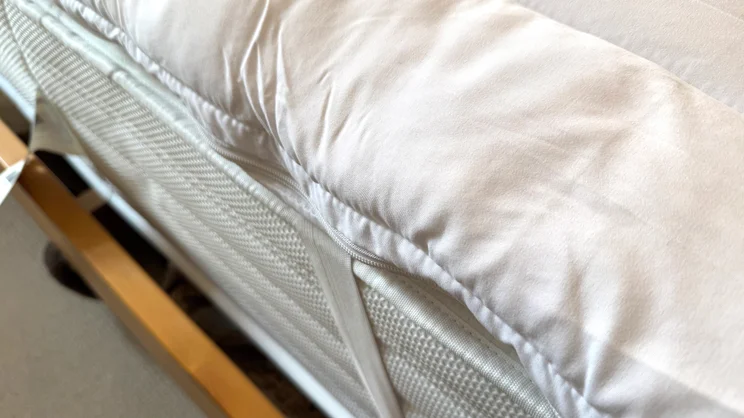 A closeup of the Dreams Dream Team Ultimate Washable Mattress Topper's edge