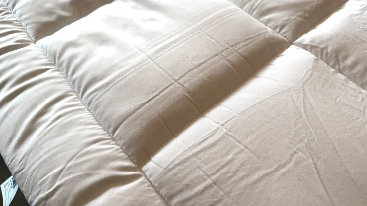 A closeup of the surface of the Dreams Dream Team Ultimate Washable Mattress Topper