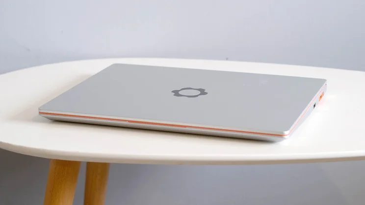The Framework Laptop 13, closed, pictured on an oval white table