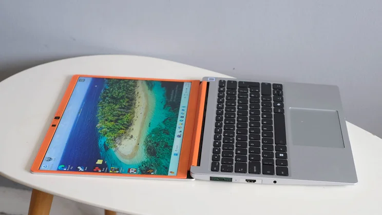 The Framework Laptop 13, open flat, pictured on an oval white table