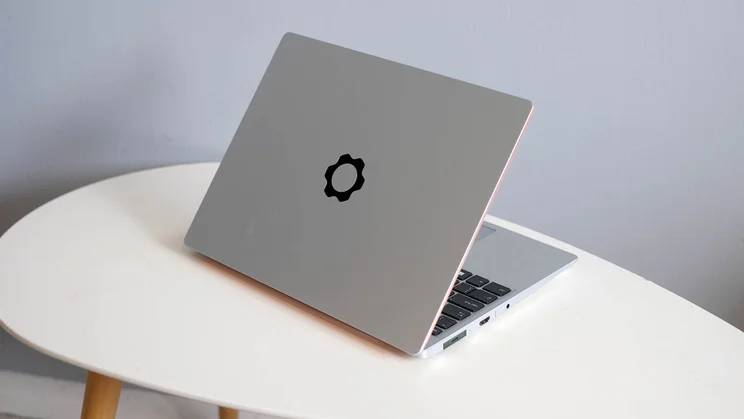 The Framework Laptop 13, open, pictured from the rear on an oval white table