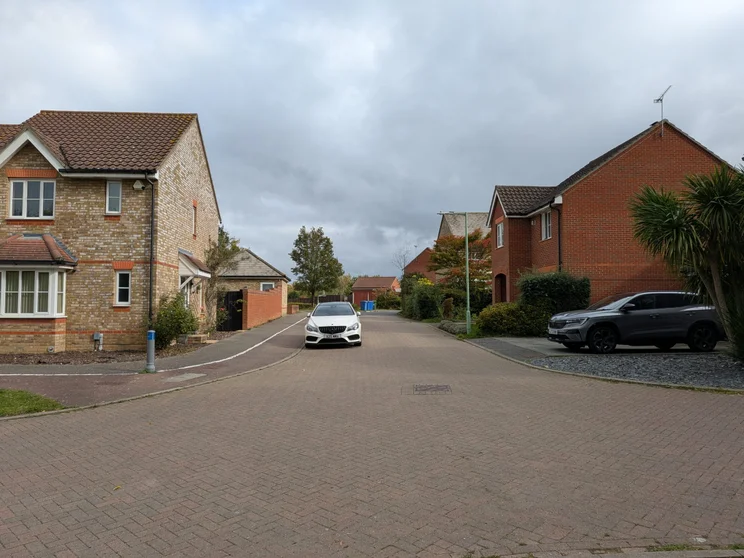 A quiet road with houses on both sides