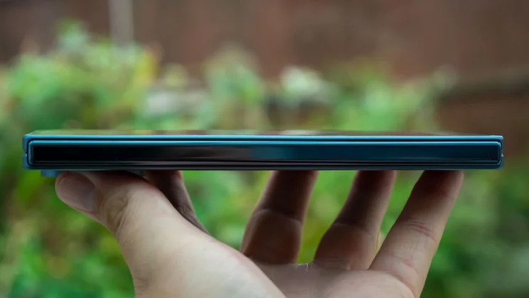 Google Pixel 10 Pro Fold folded in hand, side view