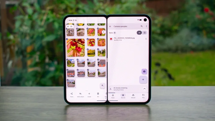 Google Pixel 10 Pro Fold unfolded on a table, showing the split-screen feature on the display