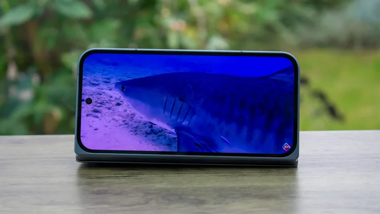 Google Pixel 10 Pro Fold folded in stand mode, with a video on the cover display