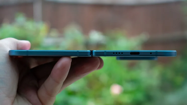 Google Pixel 10 Pro Fold unfolded in hand, side view