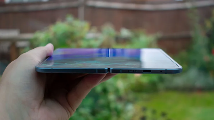Google Pixel 10 Pro Fold unfolded in hand, showing the bottom edge