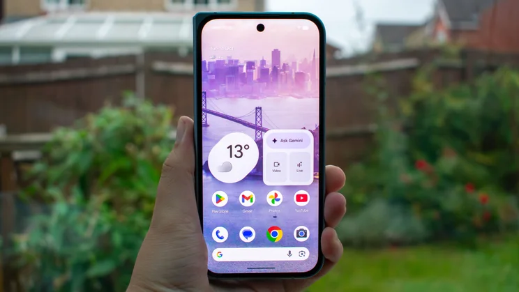 Google Pixel 10 Pro Fold folded in hand, cover display on
