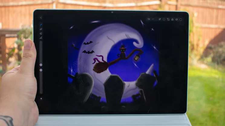Huawei MatePad 12X in hand, drawing on the display