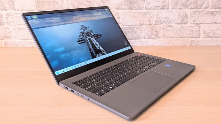 LG Gram Book AI, open on a wood desk, facing right