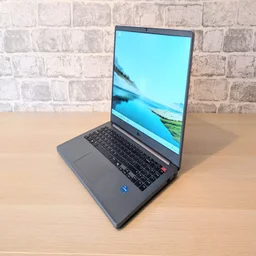 LG Gram Book AI, open on a wood desk facing to the left of the frame