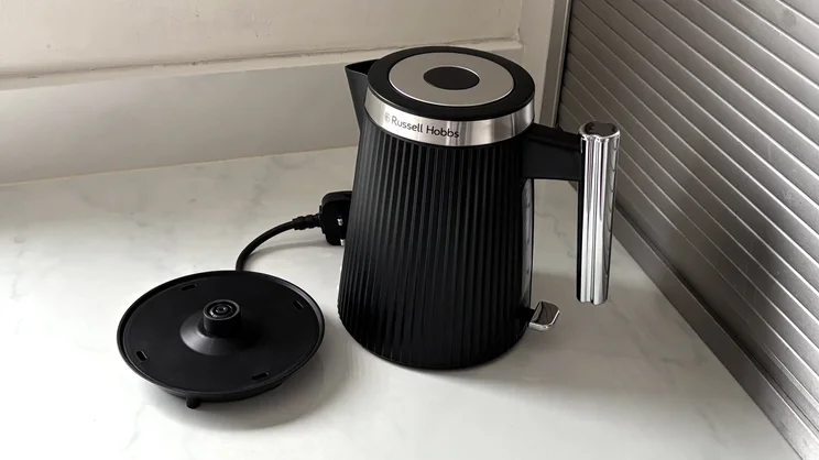 The Russell Hobbs Bronte kettle on a kitchen worktop alongside its base