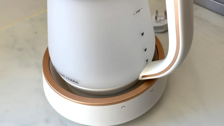 A closeup of the Russell Hobbs Calm Kettle, showing the kettle on its base and the fill lines