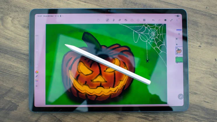 Samsung Galaxy Tab S11 on a desk with a drawing on the display and a stylus sat on it