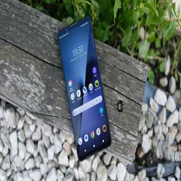 Sony Xperia 1 VII face up on a wooden beam with the display on