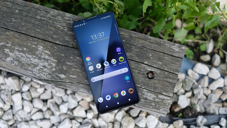 Sony Xperia 1 VII face up on a wooden beam with the display on