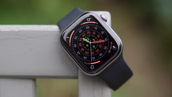 The Apple Watch Series 11 from the front, hung on a garden chair