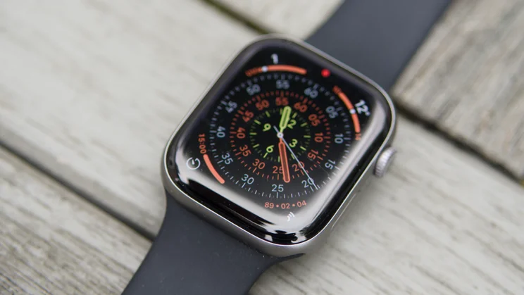 The Apple Watch Series 11 on a garden table