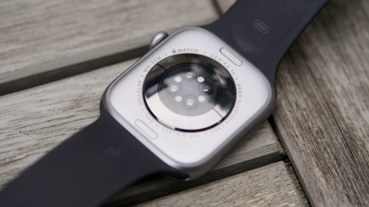 The rear of the Apple Watch Series 11 46mm on a garden table