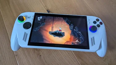 The Asus ROG Xbox Ally gaming handheld displaying gameplay from Hollow Knight: Silksong
