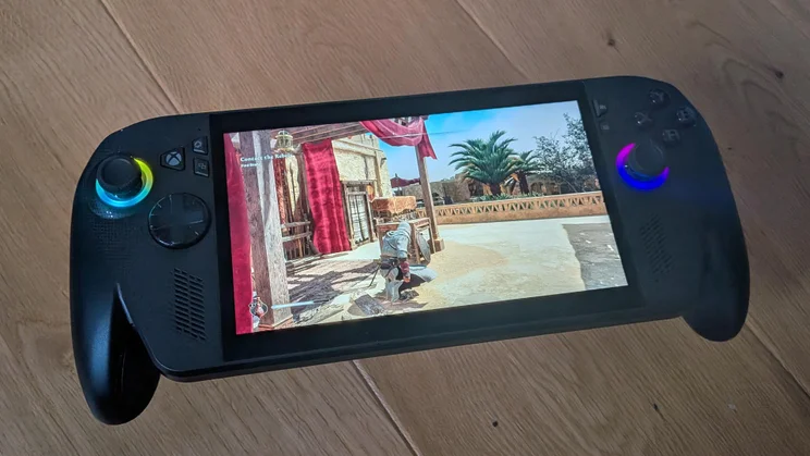 The Asus ROG Xbox Ally X gaming handheld displaying action from Assassin's Creed Mirage