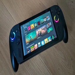 The Asus ROG Xbox Ally X gaming handheld on a wooden table