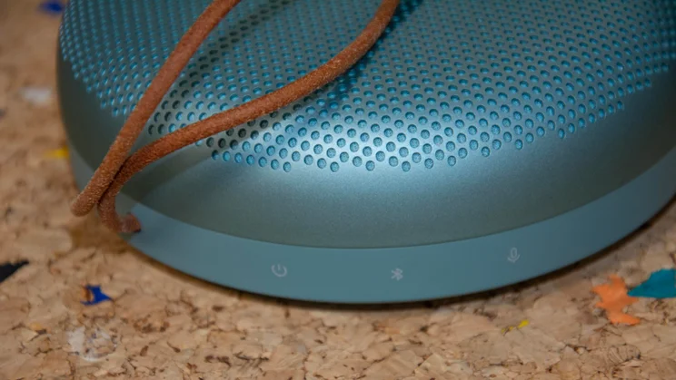 The Bluetooth, microphone and power buttons on the side of the Bang & Olufsen A1 3rd Gen Bluetooth speaker