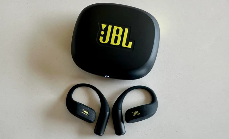 The JBL Endurance Zone open-ear headphones outside of their charging case