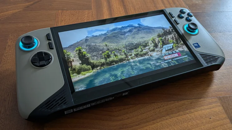 The MSI Claw 8 AI+ A2VM gaming handheld on a wooden table displaying the opening screen of Forza Horizon 5