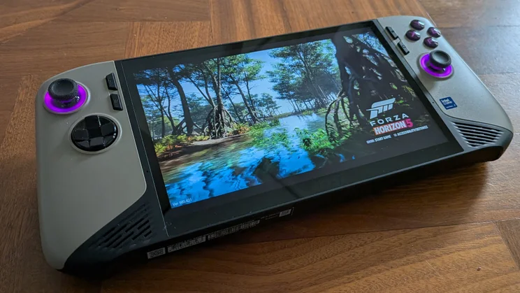 The MSI Claw 8 AI+ A2VM gaming handheld on a wooden table with Forza Horizon 5 running
