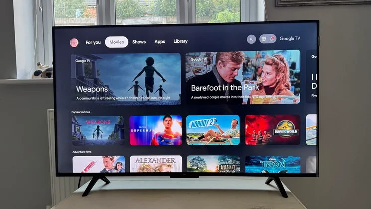 Front view of the TCL P7K QLED TV displaying the Google TV homepage