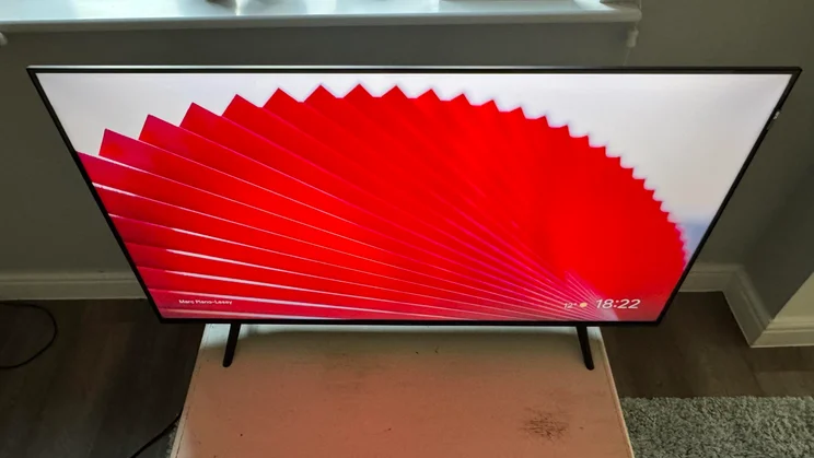 Top-down view of the TCL P7K QLED TV displaying a red fan