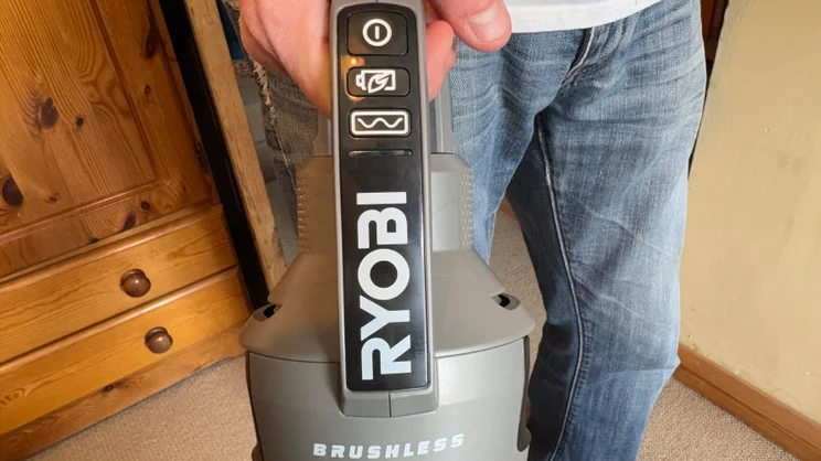 A close up of the Ryobi 18V ONE+ Cordless Stick's controls