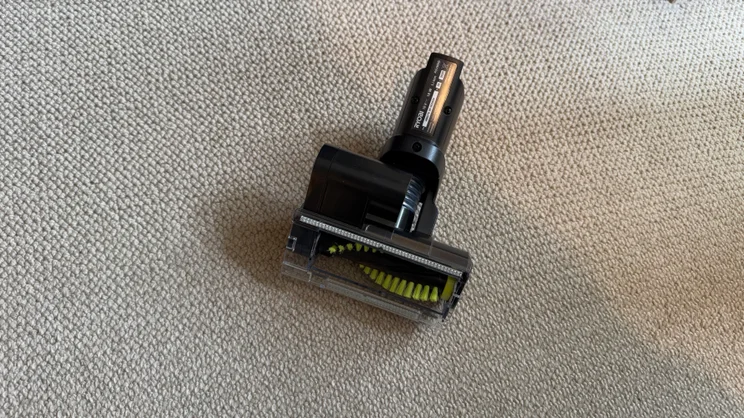 A photograph showing the underside of the Ryobi 18V ONE+ Cordless Stick's mini motorised head