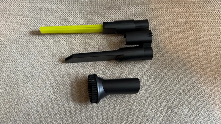 A photograph showing the Ryobi 18V ONE+ Cordless Stick's crevice tools and brushes