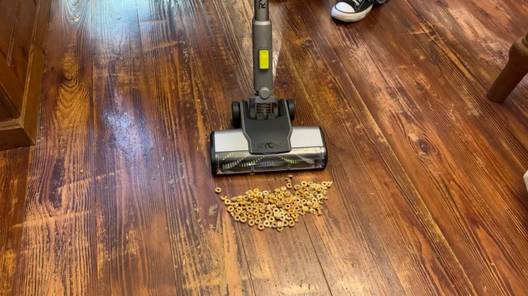 A picture of the Ryobi 18V ONE+ Cordless Stick's struggles with vacuuming Cheerios from hard floor