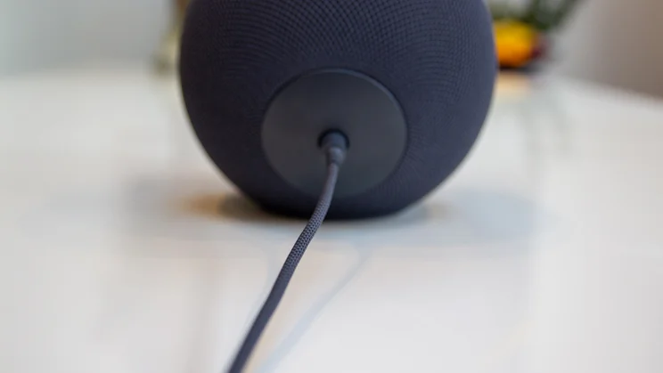 The Amazon Echo Studio 2025 pictured on a white gloss dining table from the rear